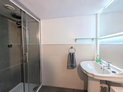 a bathroom with a shower and a sink at 2 Bed in Wasdale Head SZ053 in Nether Wasdale