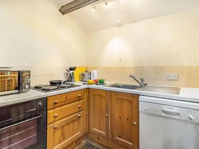 a kitchen with a sink and a stove top oven at 2 Bed in Wasdale Head SZ053 in Nether Wasdale