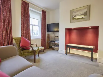 a living room with a couch and a table at 2 Bed in Keswick oc-sz009 in Keswick