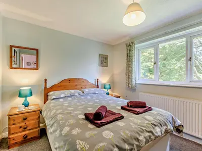 a bedroom with a bed with two towels on it at 3 Bed in Threlkeld SZ047 in Threlkeld