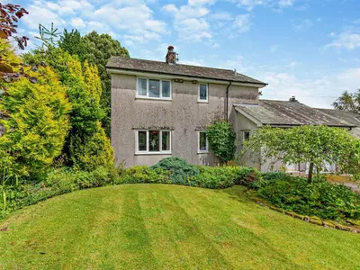 a large brick house with a large yard at 3 Bed in Threlkeld SZ047 in Threlkeld