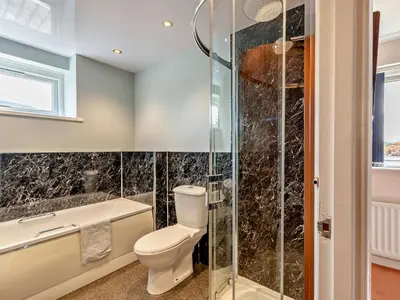 a bathroom with a toilet and a shower at 3 Bed in Threlkeld SZ047 in Threlkeld