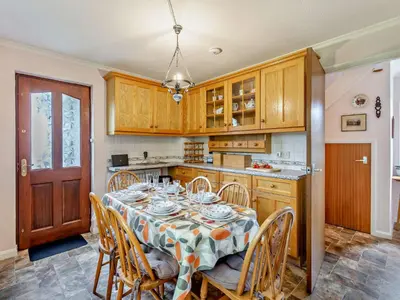 a dining room with a table and chairs in a kitchen at 3 Bed in Threlkeld SZ047 in Threlkeld