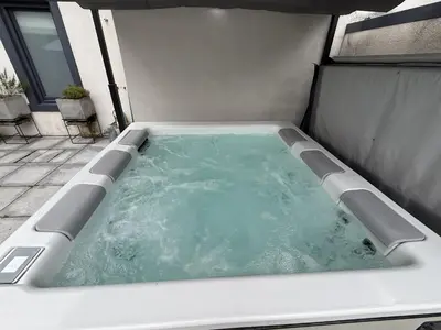 a jacuzzi tub sitting inside at Shepherdess Cottage in Moffat