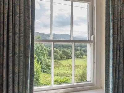 a window with a view of a green field at 3 Bed in Eskdale SZ416 in Santon Bridge