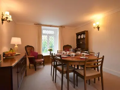 a kitchen and dining room with a table and chairs at 3 Bed in Pardshaw SZ419 in Dean