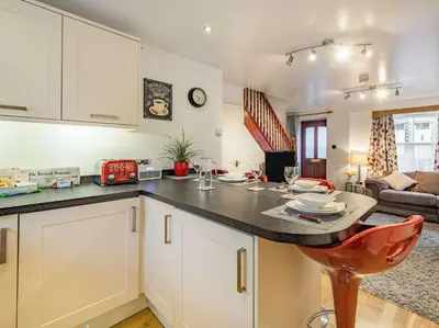 a kitchen with white cabinets and a counter top at 2 bed in Keswick SZ062 in Keswick