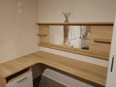 a kitchen with a wooden counter top and a mirror at Hillingworth's Hot Tub Retreat - Lochmaben in Dumfries