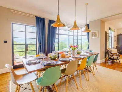 a dining room with a long table and chairs at 6 Bed in Keswick oc-89309 in Applethwaite