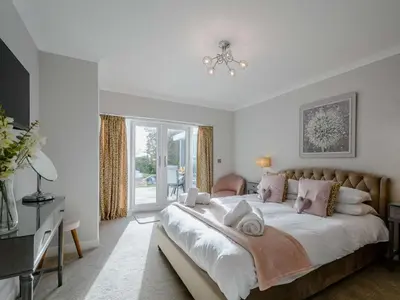 a bedroom with a large bed and a window at 1 Bed in Sandyhills 85904 in Fairgirth