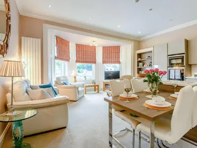 a large living room with a table and chairs at 2 Bed in Portinscale 89261 in Portinscale