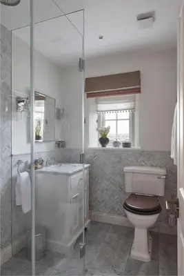 a bathroom with a toilet and a sink and a shower at The Little Cottage in Chapel Stile