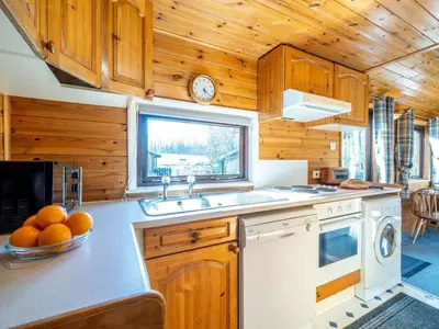 a kitchen with a sink and a stove and a window at 1 Bed in Keswick oc-82550 in Keswick
