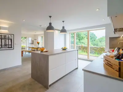 a kitchen with white cabinets and a large window at 3 Bed in Matterdale oc-83002 in Dockray