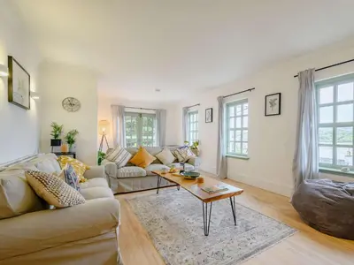a living room with a couch and a table at 3 Bed in Kippford 88274 in Kippford