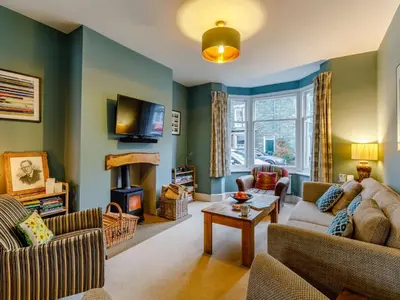 a living room with two couches and a tv at 3 Bed in Keswick 86162 in Keswick