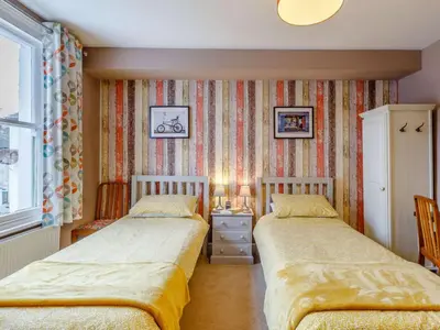 a bedroom with two beds and a window at 3 Bed in Keswick 86162 in Keswick