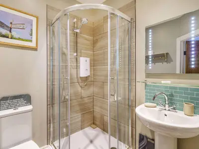 a bathroom with a shower and a sink at 3 Bed in Keswick 86162 in Keswick