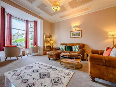 a living room with a couch and a table at 3 Bed in Keswick 86867 in Keswick
