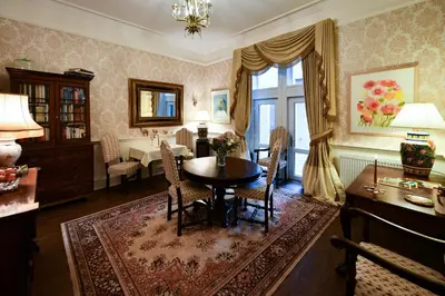 a living room with a table and a dining room at The Townhouse Ayr - Luxury B&B - adults only in Ayr