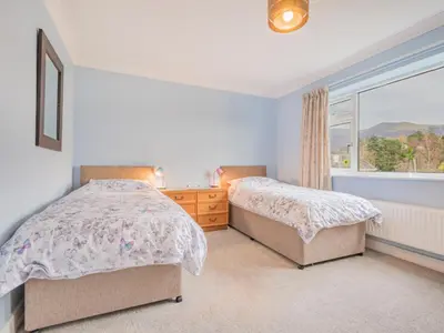 a bedroom with two beds and a window at 2 Bed in Portinscale SZ071 in Portinscale
