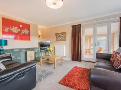 a living room with a couch and a table at 2 Bed in Portinscale SZ071 in Portinscale