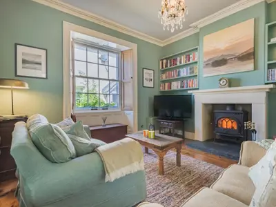 a living room with a couch and a fireplace at 2 Bed in Keswick oc-sz126 in Keswick