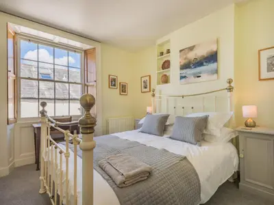 a bedroom with a white bed and a large window at 2 Bed in Keswick oc-sz126 in Keswick