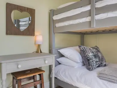 a bedroom with a bunk bed and a desk at 2 Bed in Keswick oc-sz126 in Keswick