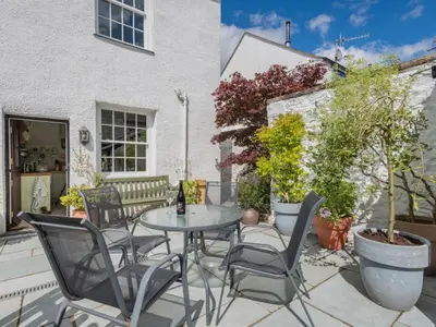 a patio with a table and chairs at 2 Bed in Keswick oc-sz126 in Keswick