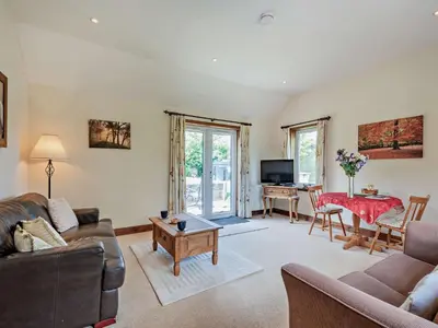 a living room with a couch and a table at 1 Bed in Balmaclellan CA371 in Castle Douglas