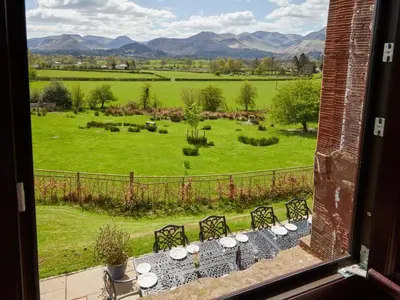 a table with a view of a field from a window at 8 Bed in Applethwaite SZ373 in Applethwaite