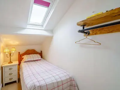 a small bedroom with a bed and a window at 3 Bed in Bassenthwaite 84024 in Bassenthwaite
