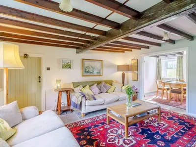a living room with a couch and a table at 3 Bed in Bassenthwaite 84024 in Bassenthwaite