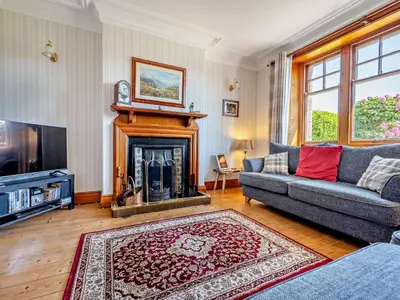 a living room with a couch and a fireplace at 3 Bed in Holmrook oc-sz414 in Santon Bridge