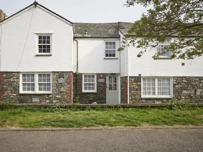 an old brick house with white doors and windows at 2 Bed in Keswick oc-sz140 in Keswick