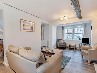 a living room with a couch and chairs and a tv at 2 Bed in Keswick oc-sz140 in Keswick