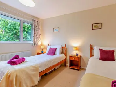 a bedroom with two beds and a window at 2 Bed in Keswick oc-sz008 in Keswick