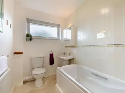 a white bathroom with a toilet and a sink at 2 Bed in Keswick oc-sz008 in Keswick