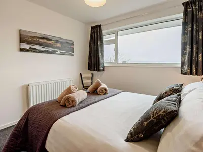 a bedroom with a bed with two teddy bears on it at 2 Bed in Keswick oc-sz116 in Keswick