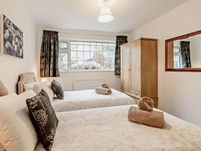 a bedroom with two beds and a window at 2 Bed in Keswick oc-sz116 in Keswick