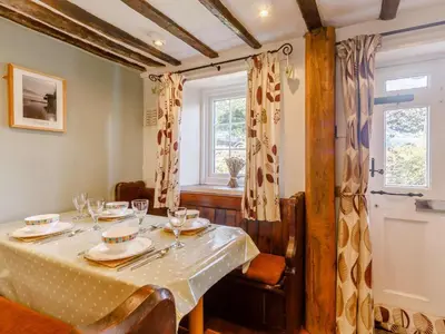 a dining room with a table and a window at 2 Bed in Keswick oc-sz341 in Portinscale