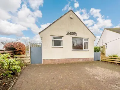 a white house with a gate and a driveway at 1 Bed in Keswick SZ133 in Keswick