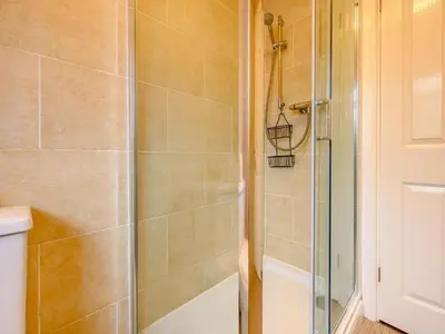 a shower with a glass door in a bathroom at 1 Bed in Keswick SZ133 in Keswick