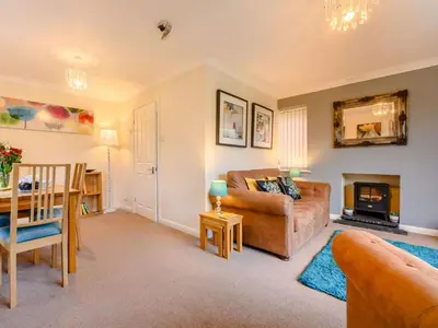 a living room with a couch and a table at 1 Bed in Keswick SZ133 in Keswick