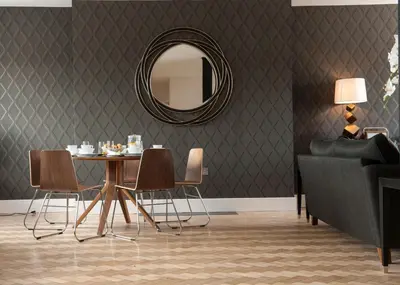 a dining room with a table and a mirror at The Halston Carlisle in Carlisle