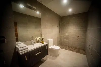 a bathroom with a toilet and a sink at The Halston Carlisle in Carlisle