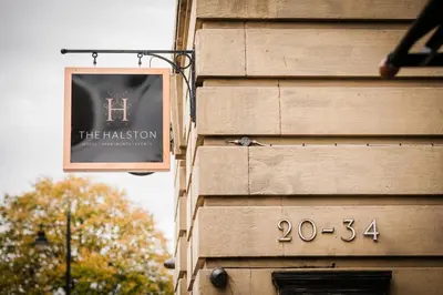 a sign on the side of a building at The Halston Carlisle in Carlisle