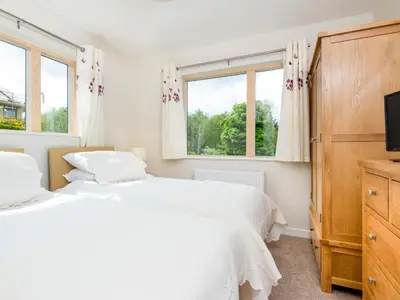 two white beds in a bedroom with a window at 4 Bed in Keswick SZ267 in Keswick