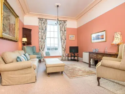 a living room with a couch and chairs and a tv at 3 Bed in Applethwaite SZ168 in Applethwaite